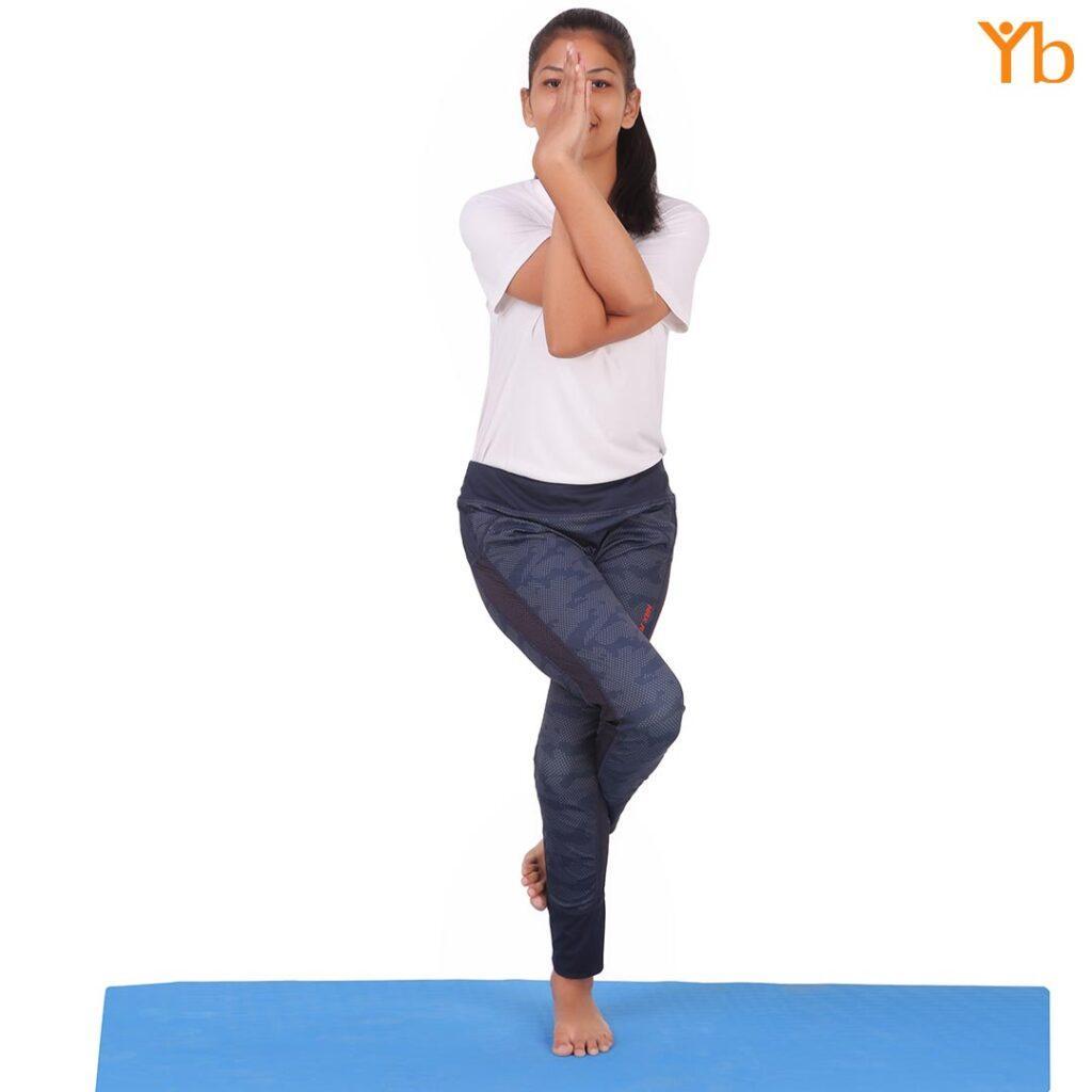 Yogisbazaar's yoga trainer performing egale pose